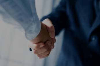 Image of two men shaking hands